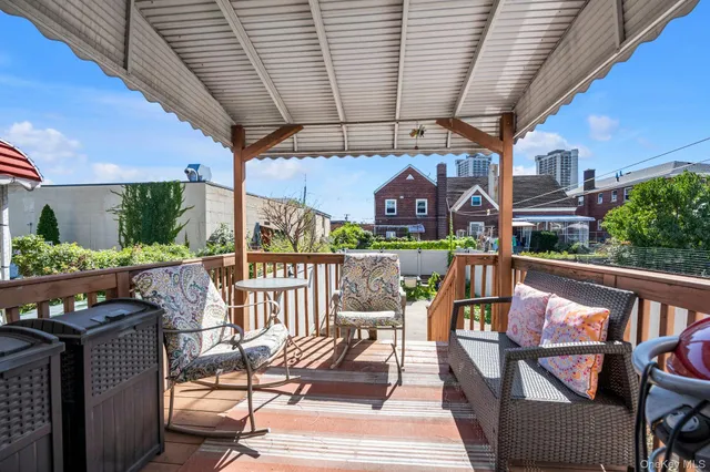 a view of balcony with furniture
