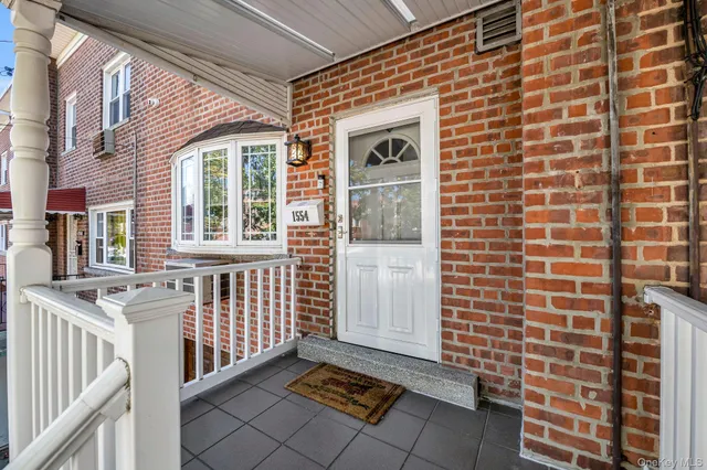 a view of a brick house with windows
