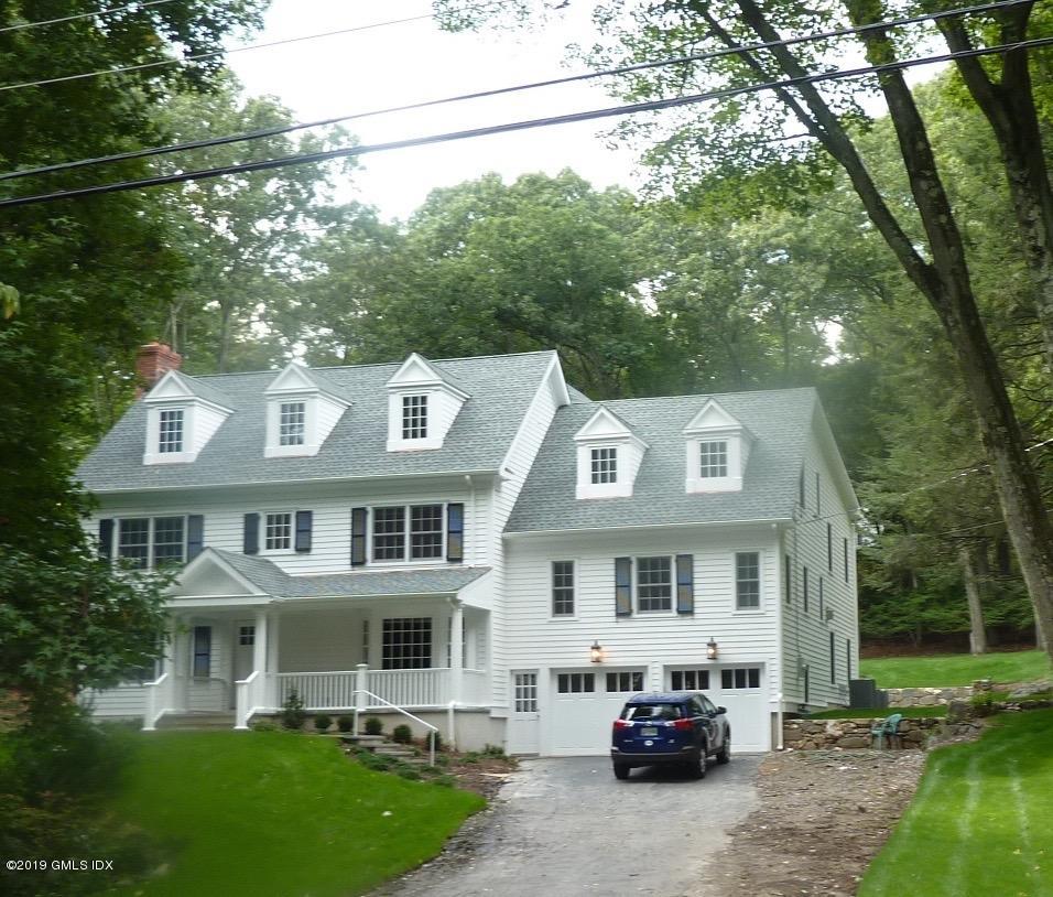 a car parked in front of a house