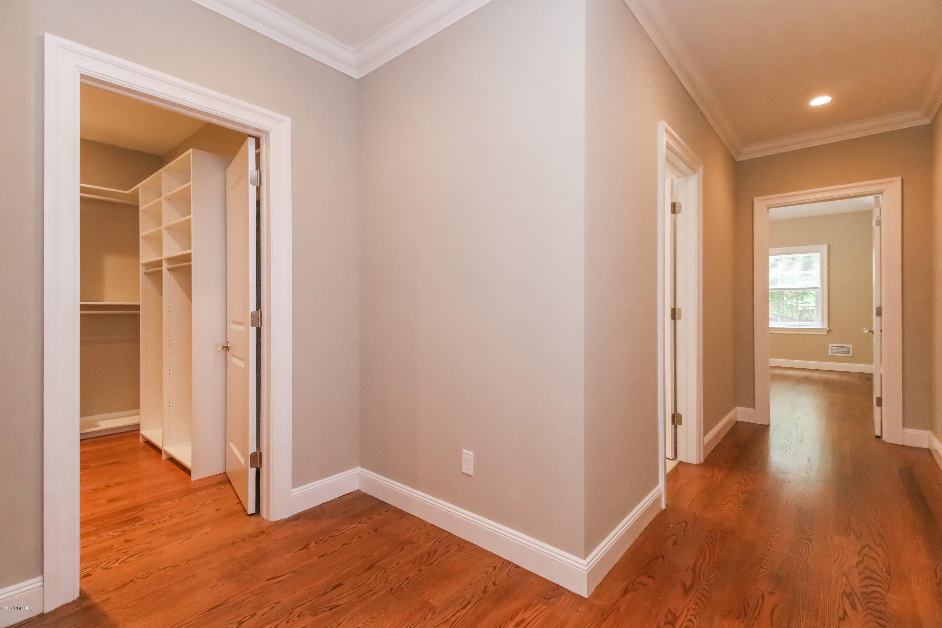 54 Dandy Drive Cos Cob, CT 06807 - Photo 13 of 35 a view of a hallway with wooden floor