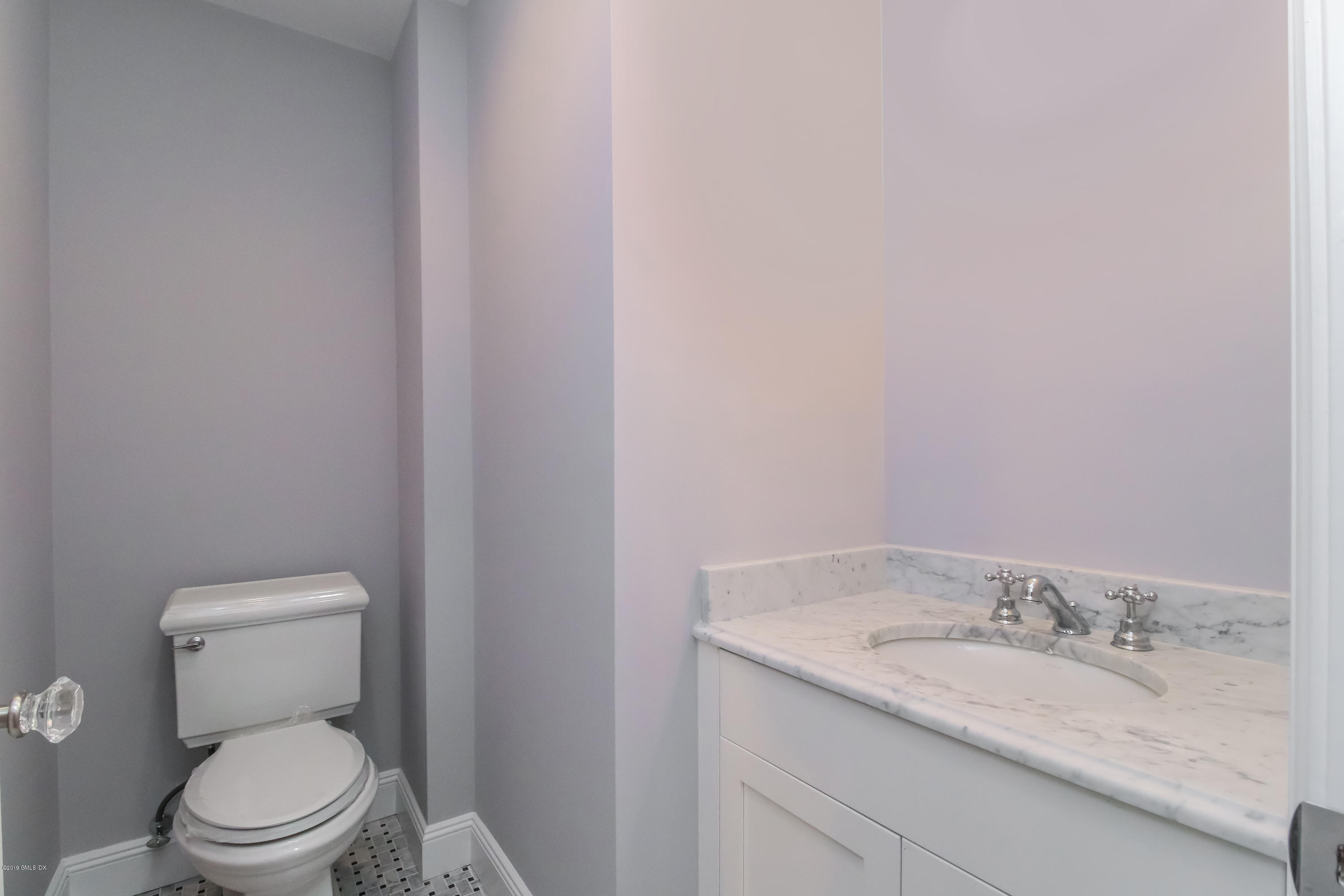 54 Dandy Drive Cos Cob, CT 06807 - Photo 26 of 35 a bathroom with a granite countertop toilet and a sink
