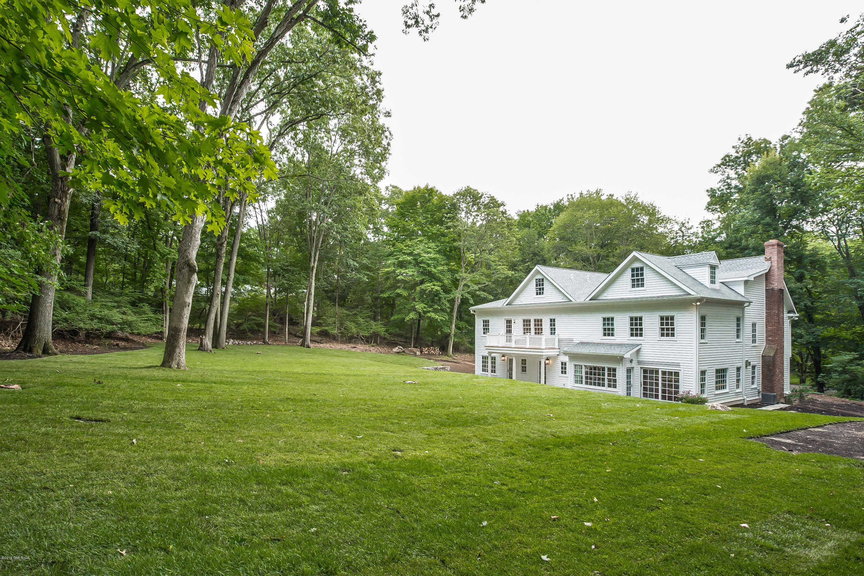 54 Dandy Drive Cos Cob, CT 06807 - Photo 31 of 35 a view of a house with a big yard