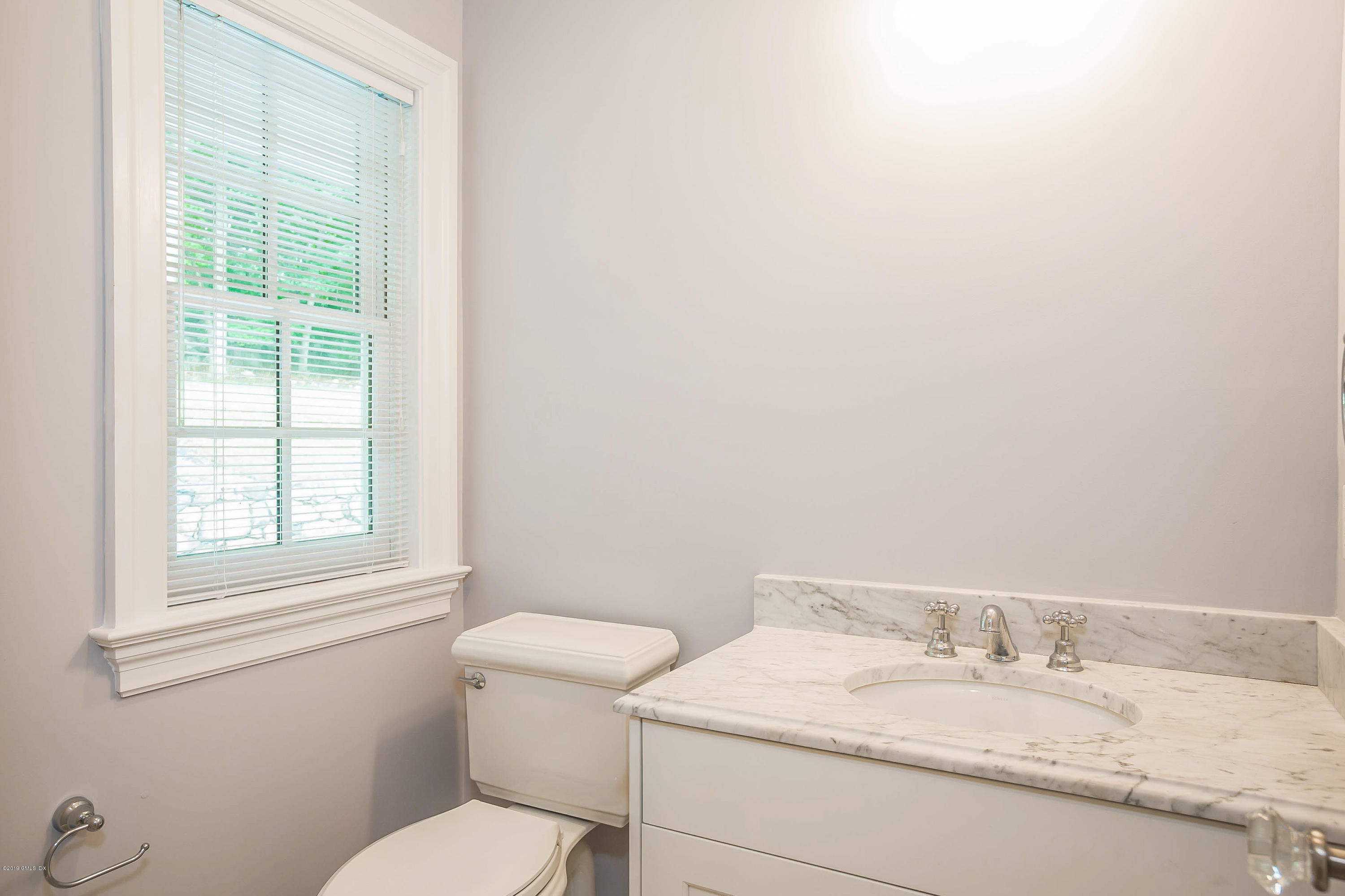 54 Dandy Drive Cos Cob, CT 06807 - Photo 7 of 35 a bathroom with a granite countertop sink a mirror and a toilet