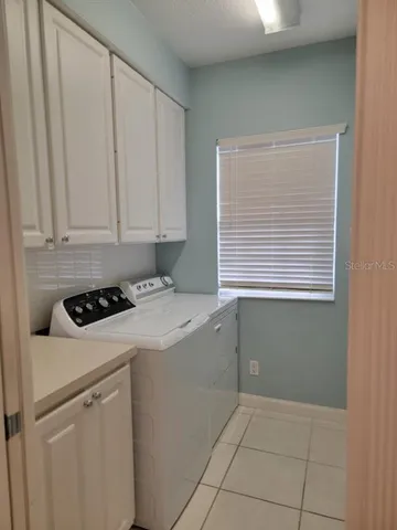 a kitchen with a stove and a window