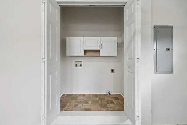 a view of a room with a ceiling fan