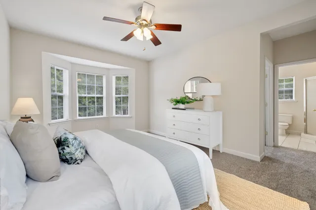 a bathroom with a double vanity sink mirror and bathtub