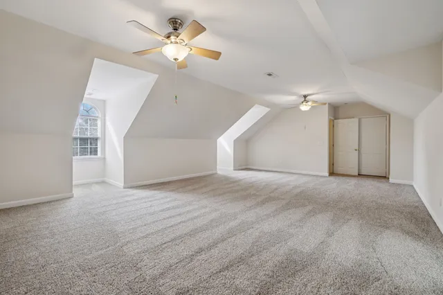 an aerial view of a house with swimming pool and big yard