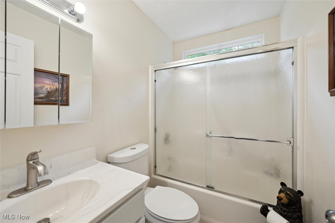 938 Long Shadow Lane Rome, OH 44085 - Photo 30 of 48 Full bath featuring vanity and shower / bath combination with glass door