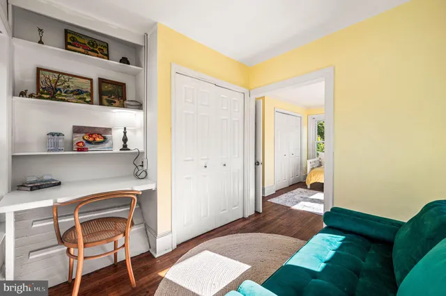 a room with a bed and a chair in it