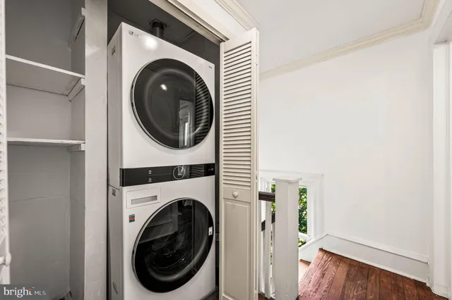 a view of a hallway with washer and dryer