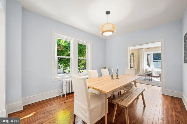 a view of a dining room with furniture window and wooden floor
