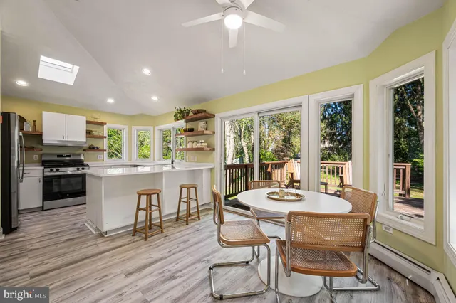 a view of a dining room with furniture window and wooden floor