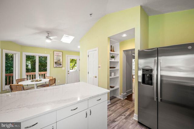 a kitchen with a refrigerator and countertop