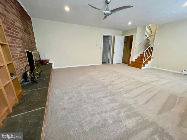 an empty room with a fireplace