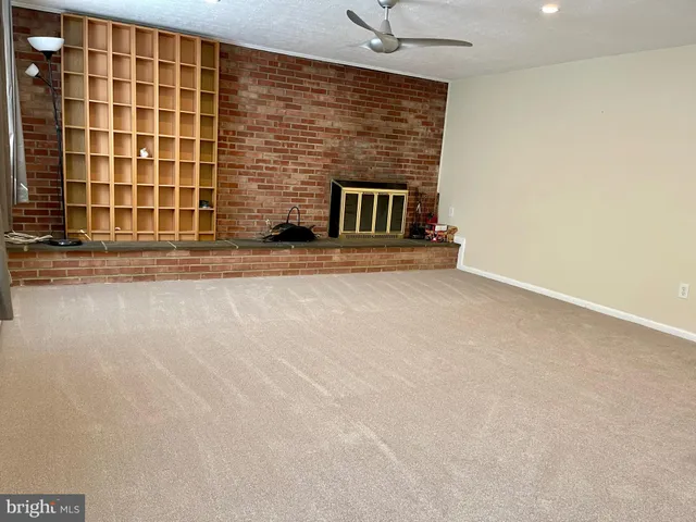 a view of outdoor space with wooden deck and furniture