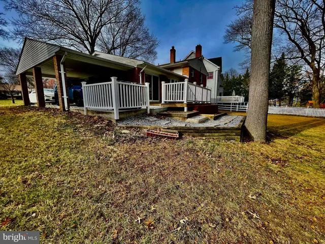 a view of a backyard with a sitting area