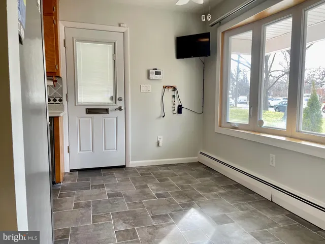 a view of an empty room and a window