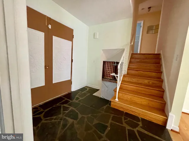 a view of room with window and wooden floor