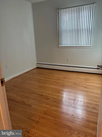 a front view of a house with car parked