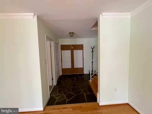 a living room with furniture a rug and a toilet