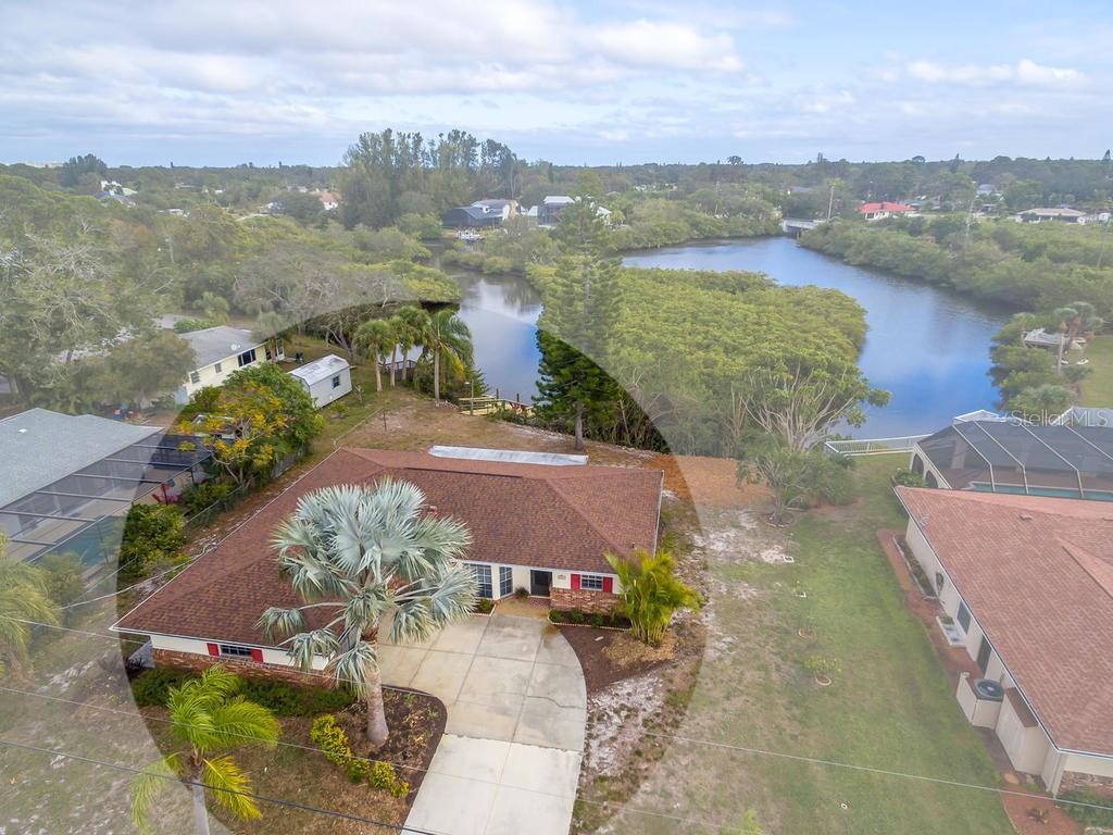 1087 Linden Road Venice, FL 34293 - Photo 1 of 1 a view of a lake in middle of the town