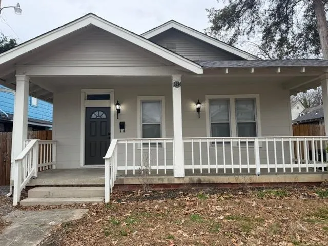 a view of a house with wooden deck