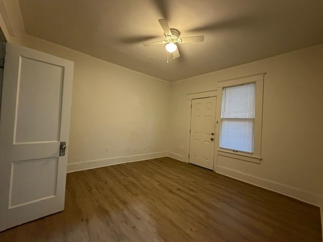 1073 Bruce Street Memphis, TN 38104 - Photo 11 of 12 a view of an empty room with wooden floor and a window
