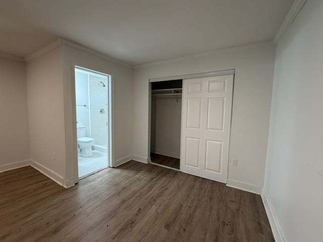 1073 Bruce Street Memphis, TN 38104 - Photo 7 of 12 a view of an empty room with wooden floor
