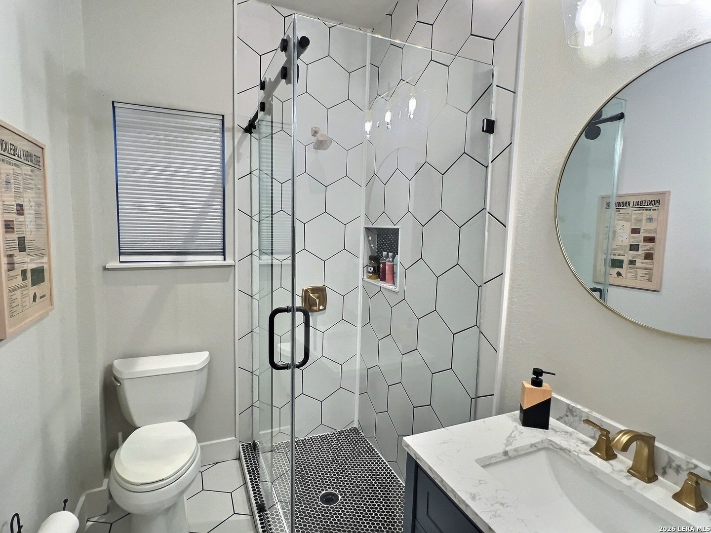 404 West Walnut Street Seguin, TX 78155 - Photo 16 of 32 a bathroom with a toilet sink and shower