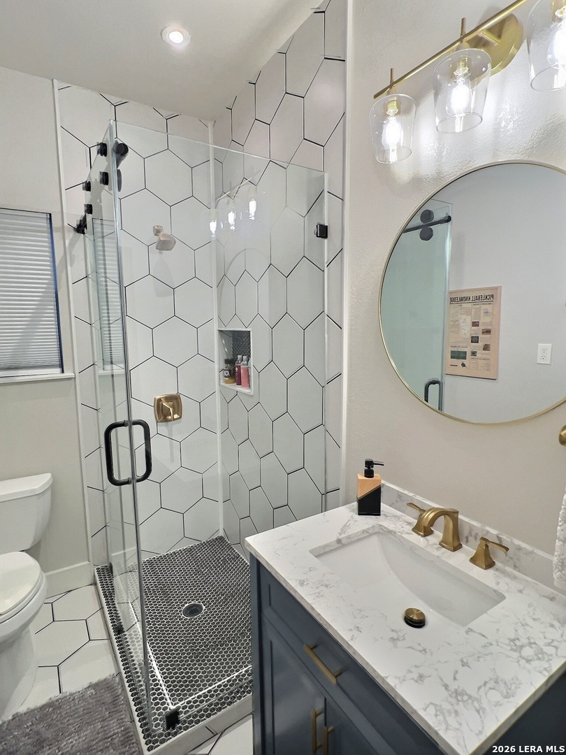 404 West Walnut Street Seguin, TX 78155 - Photo 17 of 32 a bathroom with a sink toilet and shower