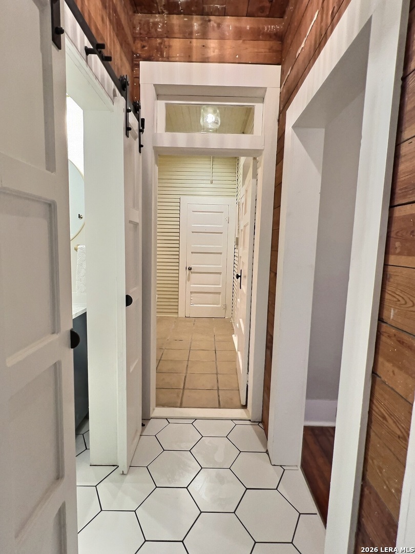 404 West Walnut Street Seguin, TX 78155 - Photo 19 of 32 a view of walk in closet with hardwood