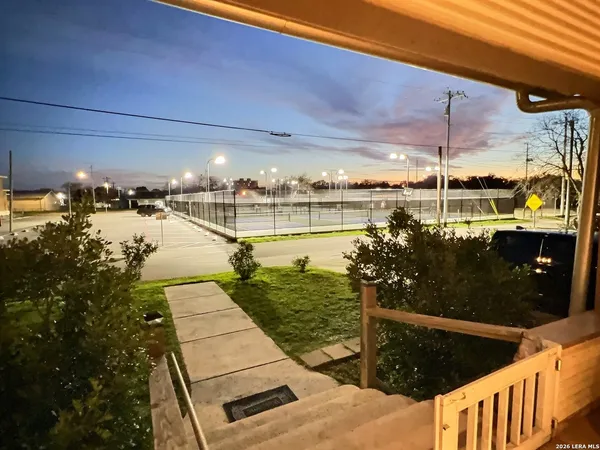a view of a balcony with chairs