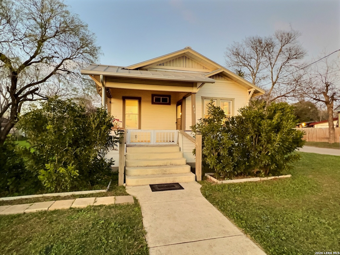 404 West Walnut Street Seguin, TX 78155 - Photo 26 of 32 a front view of a house with a yard and garage