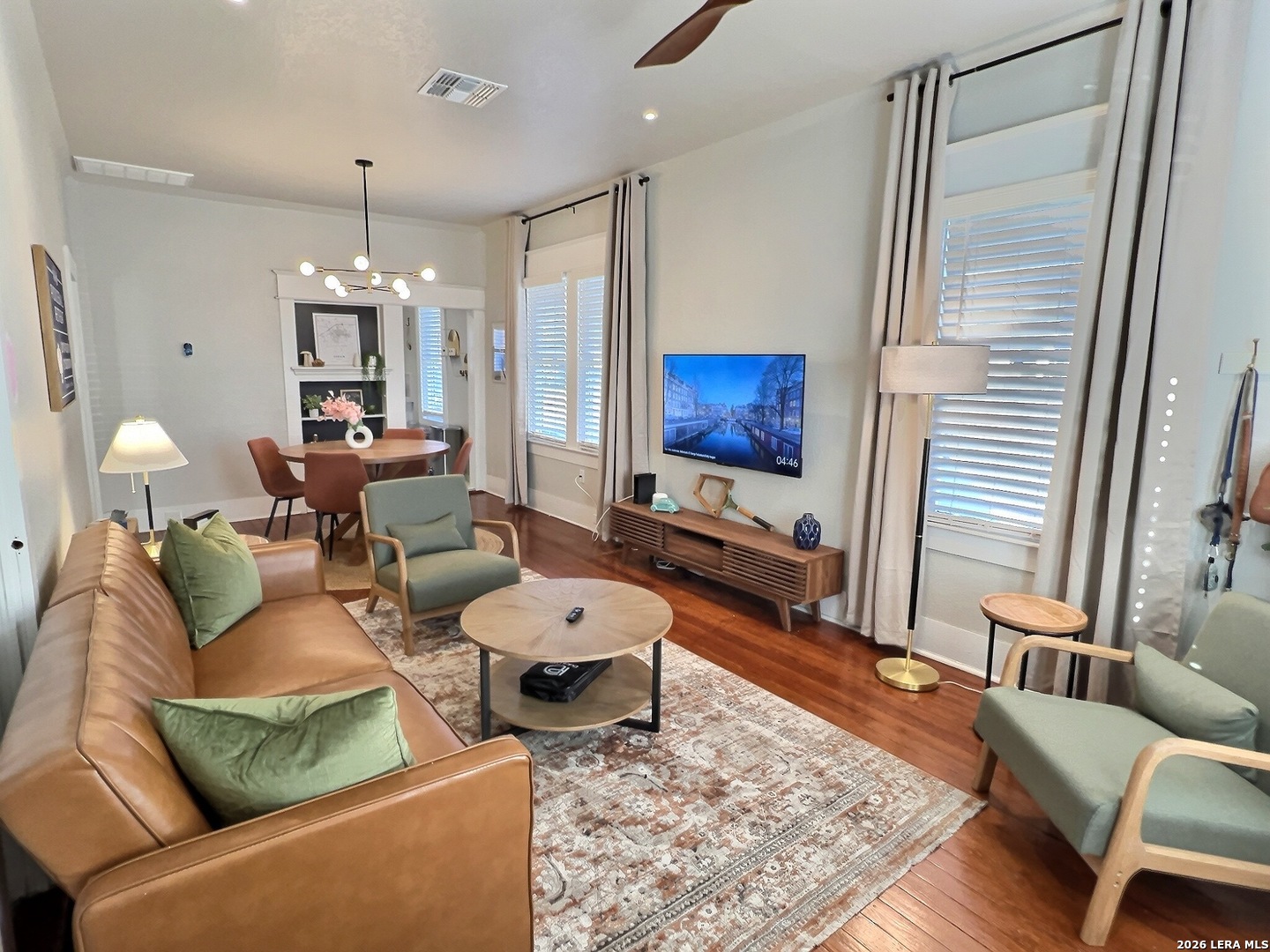 404 West Walnut Street Seguin, TX 78155 - Photo 3 of 32 a living room with patio furniture and a flat screen tv