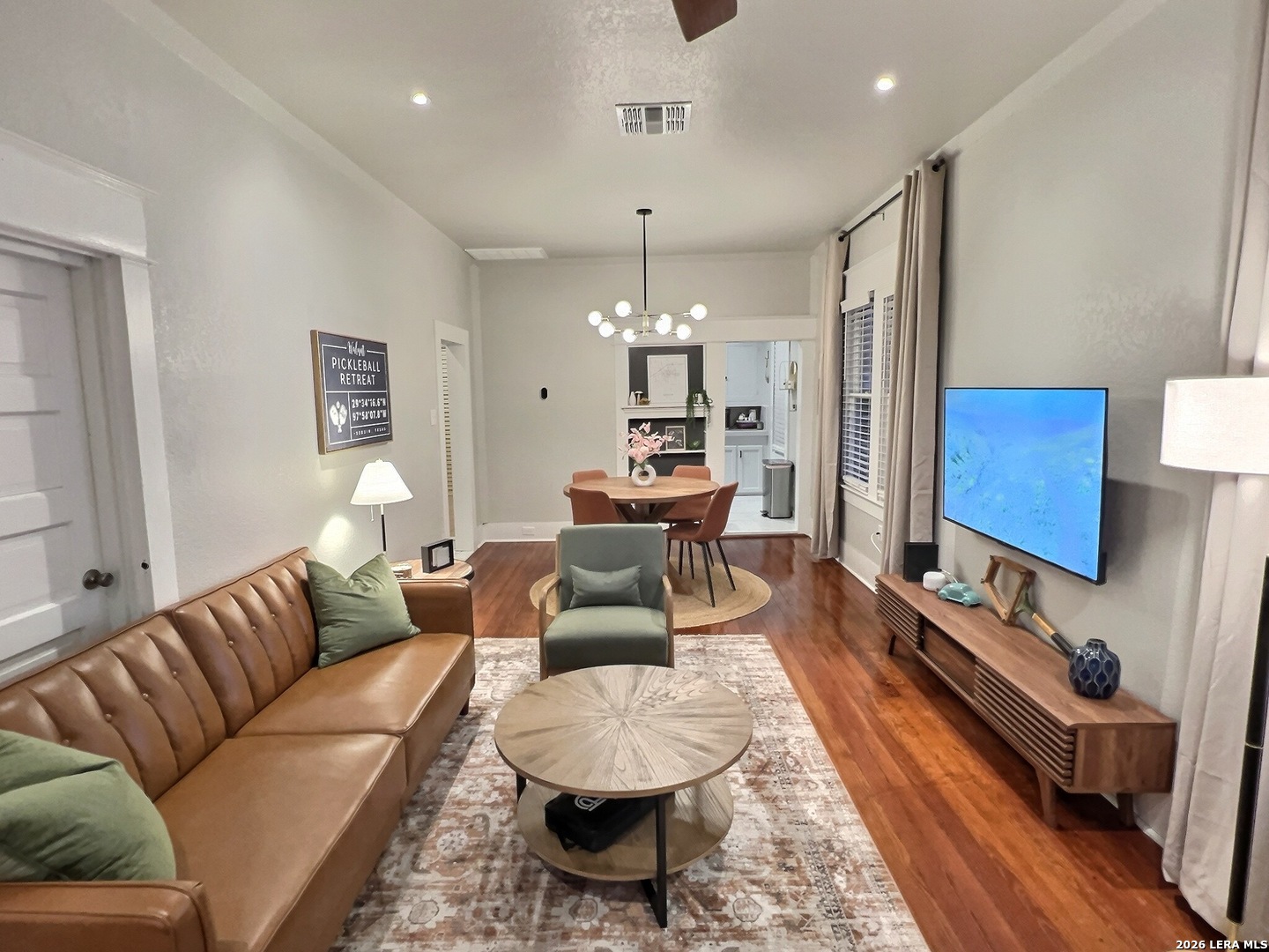 404 West Walnut Street Seguin, TX 78155 - Photo 4 of 32 a living room with furniture and a chandelier