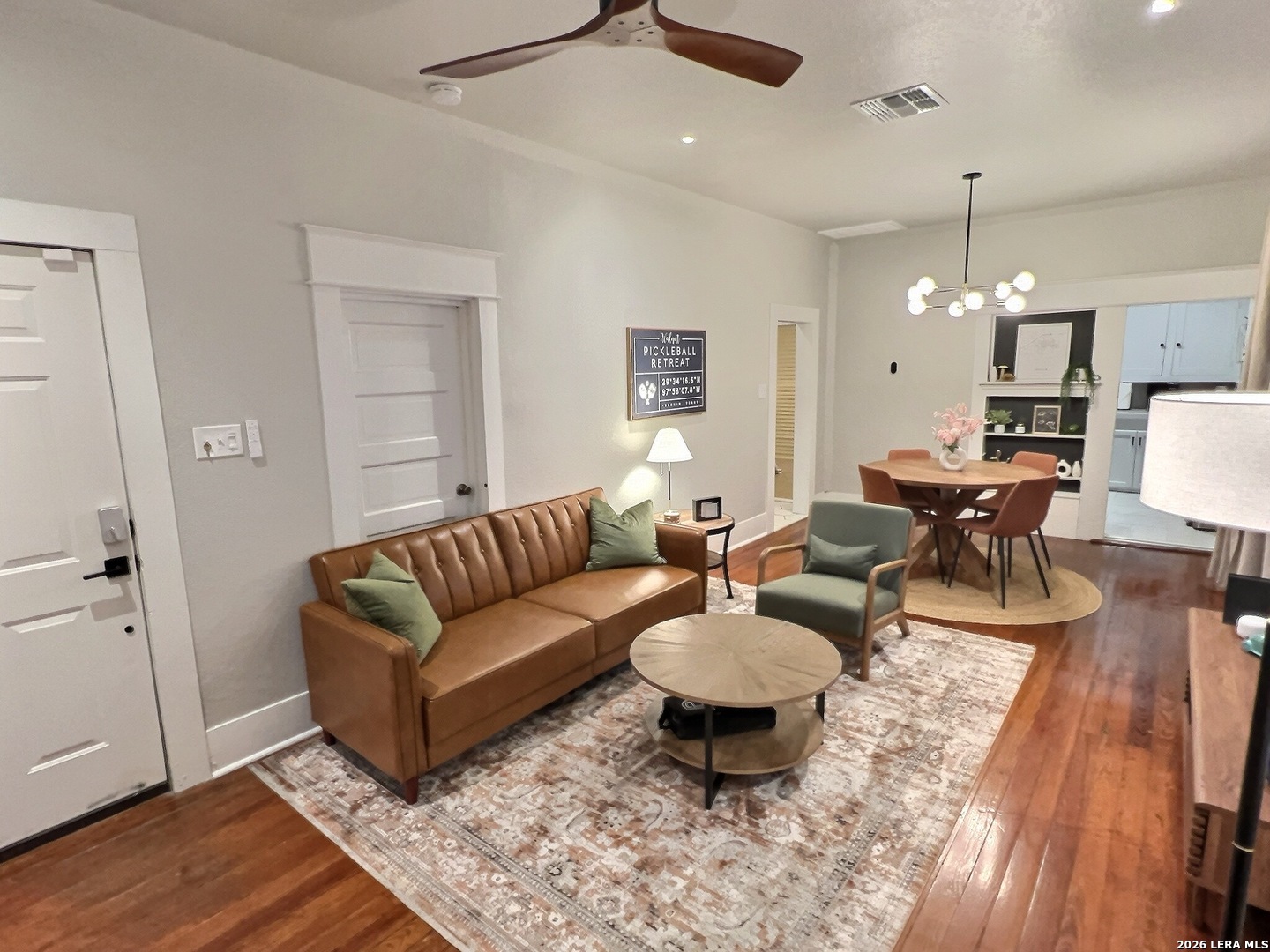 404 West Walnut Street Seguin, TX 78155 - Photo 5 of 32 a living room with furniture a rug and a chandelier