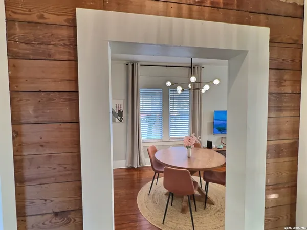 a view of a dining room with furniture and bathroom