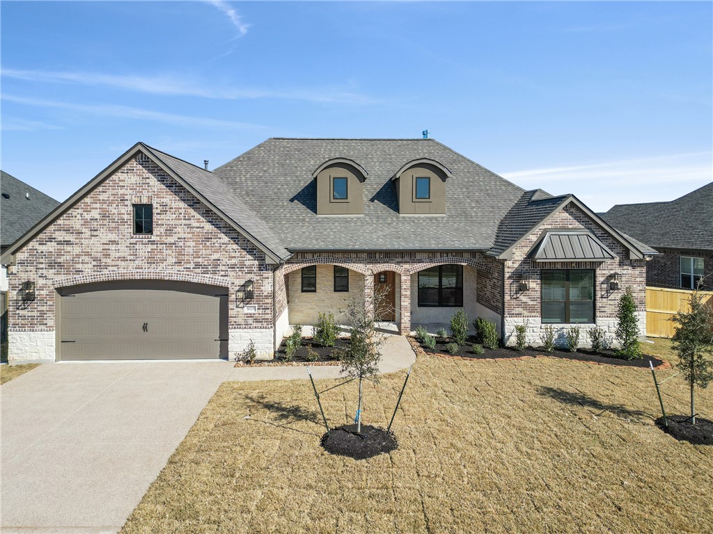 5025 Greenstone Way Bryan, TX 77802 - Photo 1 of 1 a front view of a house with yard