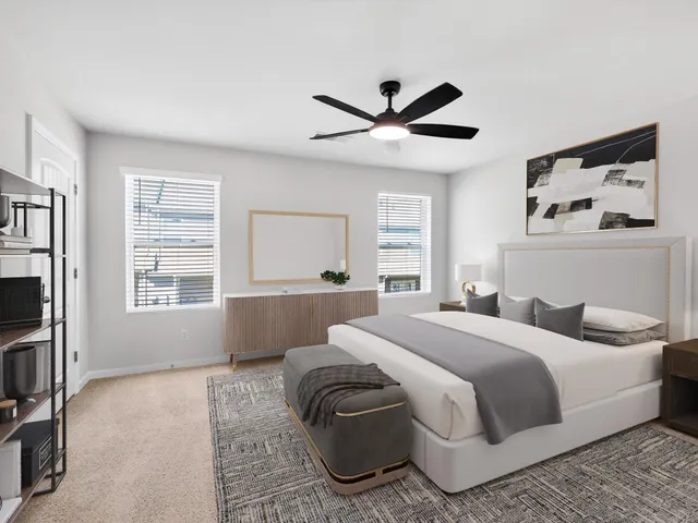 a bedroom with a large bed and a window