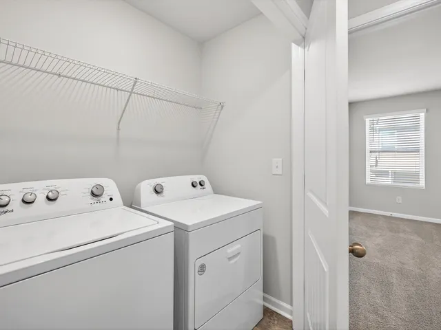a view of storage and utility room with washer and dryer