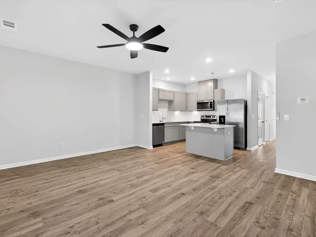a view of kitchen with wooden floor