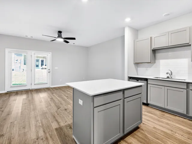 a kitchen with a sink and cabinets