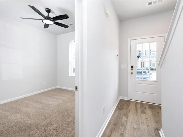 a view of an empty room with a window