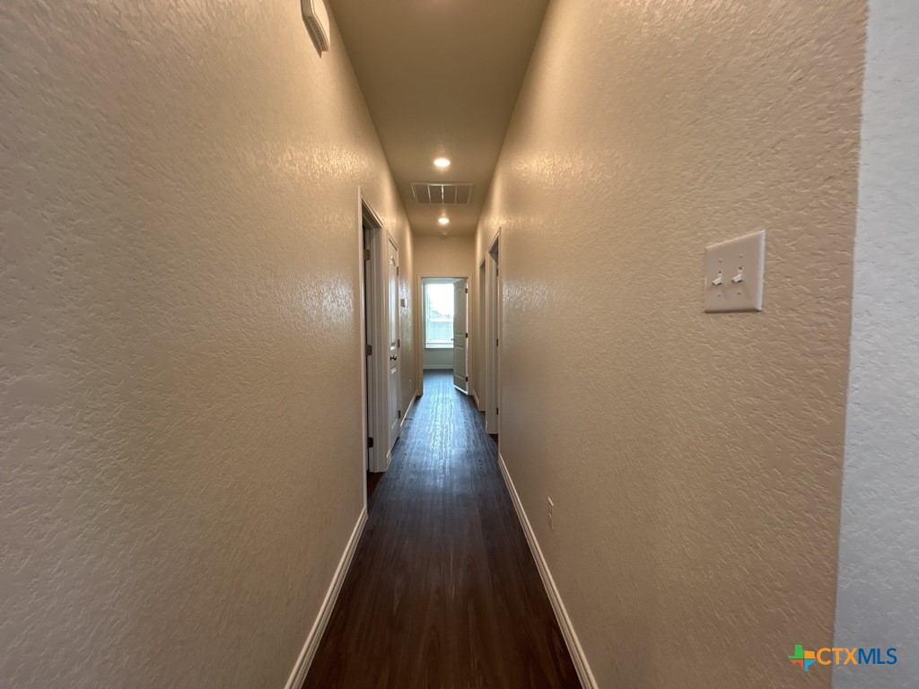 5110 Rose Gdn Loop Killeen, TX 76542 - Photo 12 of 19 a view of a hallway with wooden floor