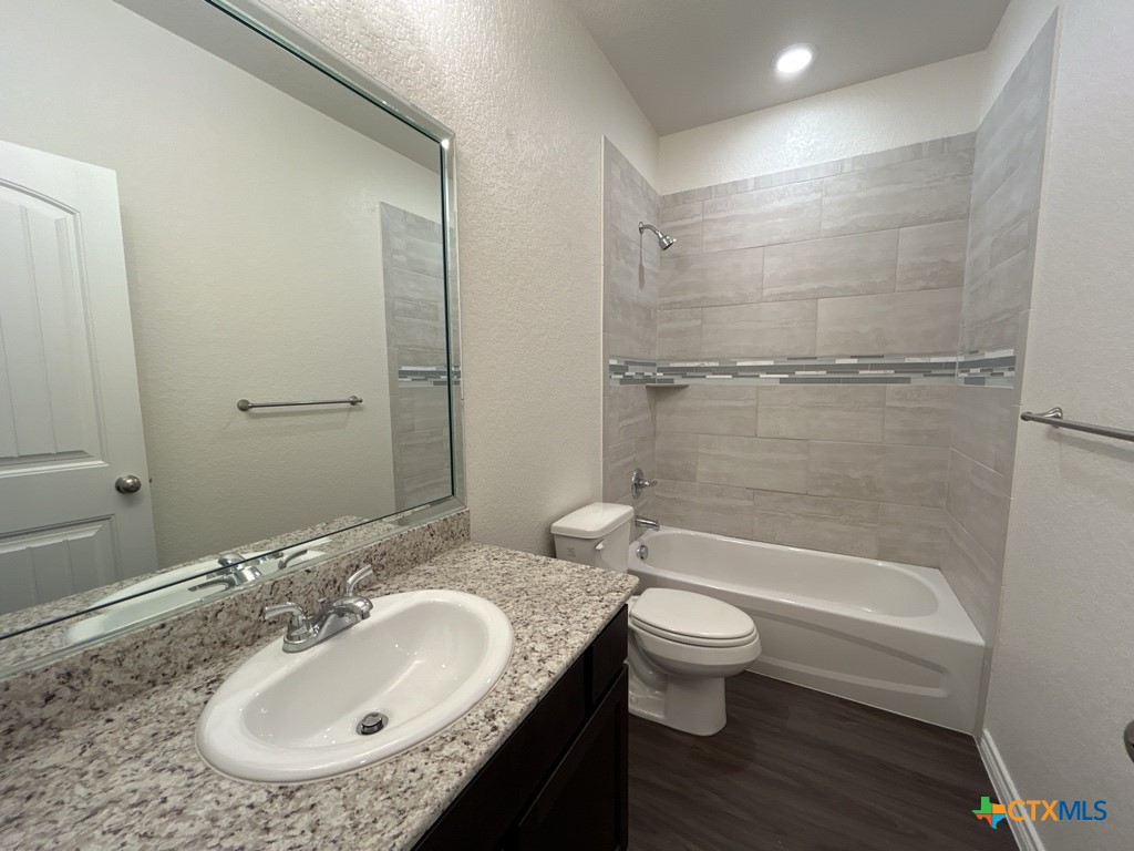 5110 Rose Gdn Loop Killeen, TX 76542 - Photo 13 of 19 a bathroom with a sink toilet and shower