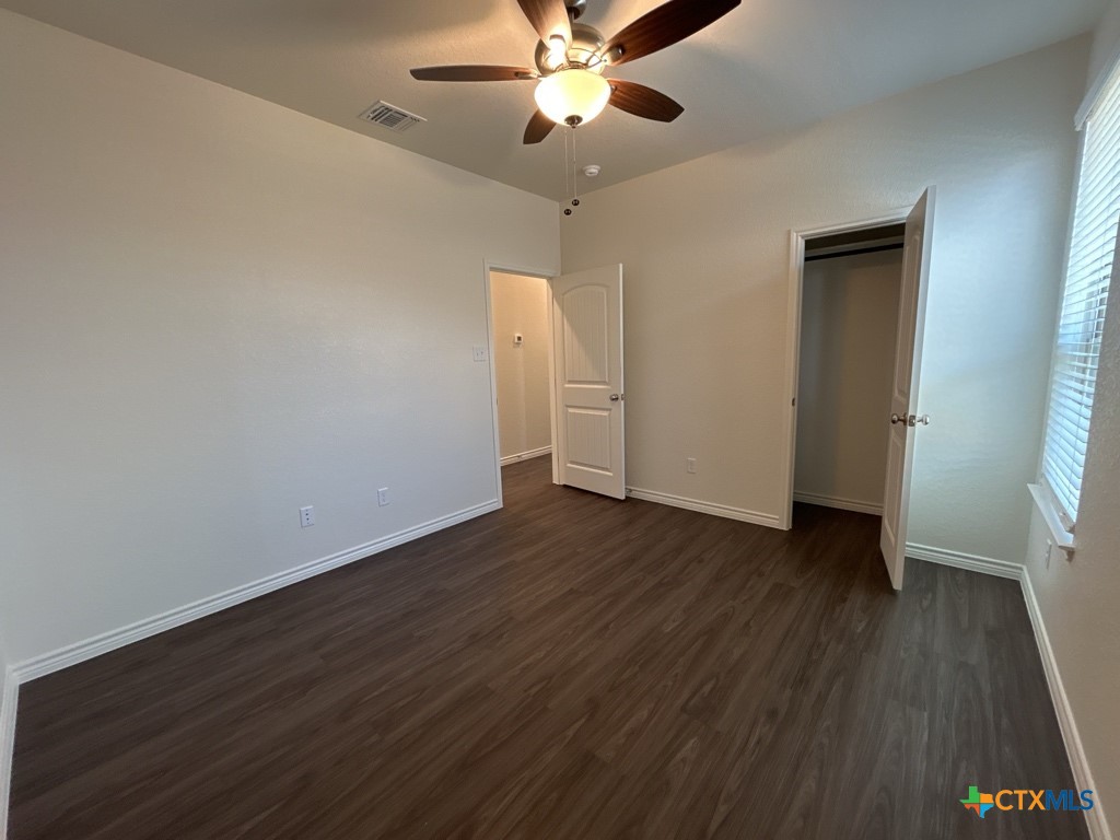 5110 Rose Gdn Loop Killeen, TX 76542 - Photo 16 of 19 wooden floor in an empty room with a window
