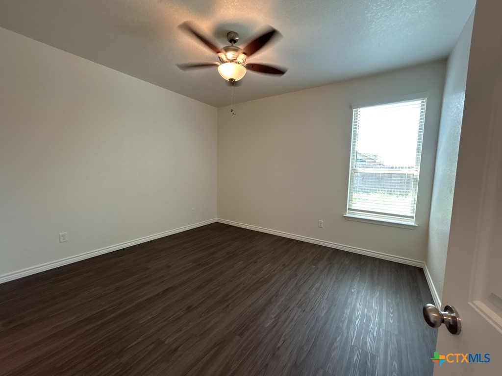 5110 Rose Gdn Loop Killeen, TX 76542 - Photo 18 of 19 a view of an empty room with wooden floor and a window