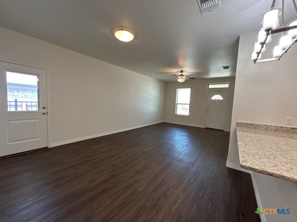5110 Rose Gdn Loop Killeen, TX 76542 - Photo 4 of 19 a view of empty room with wooden floor and fan