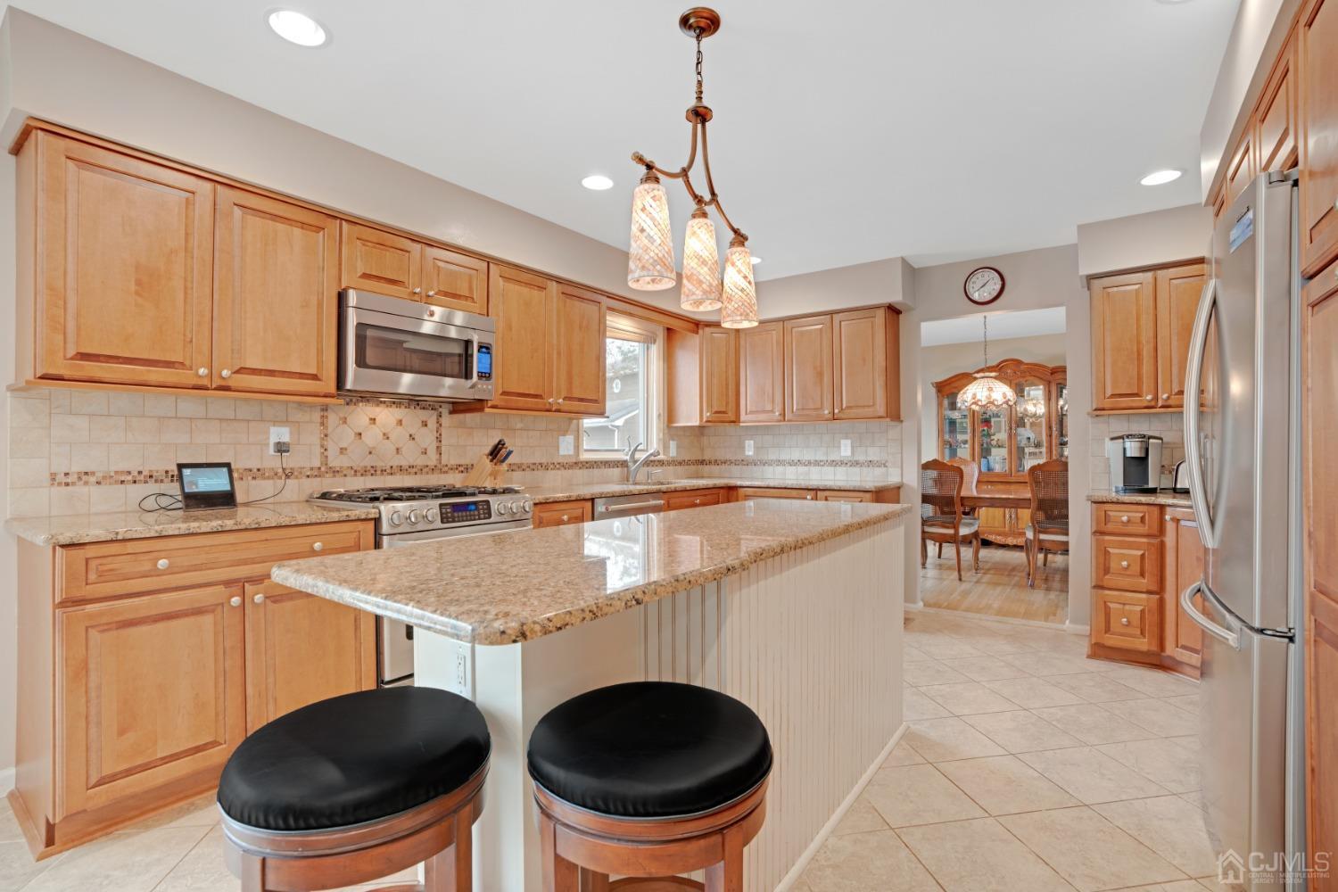 5 Diamond Drive Edison, NJ 08820 - Photo 15 of 35 a kitchen with a stove a sink and a refrigerator