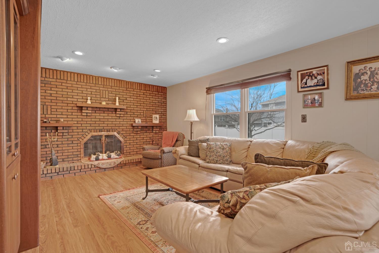 5 Diamond Drive Edison, NJ 08820 - Photo 17 of 35 a living room with furniture and a flat screen tv